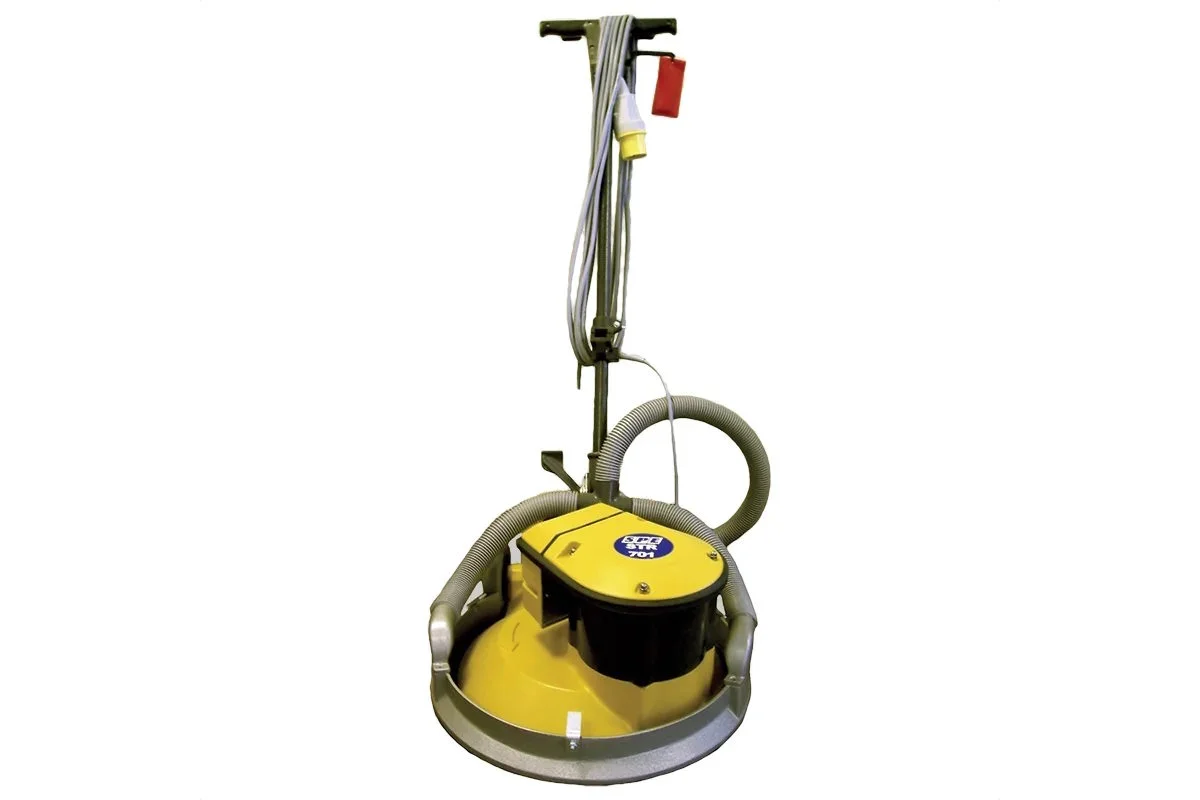 Concrete floor sander with dust hose for surface preparation and grinding.
